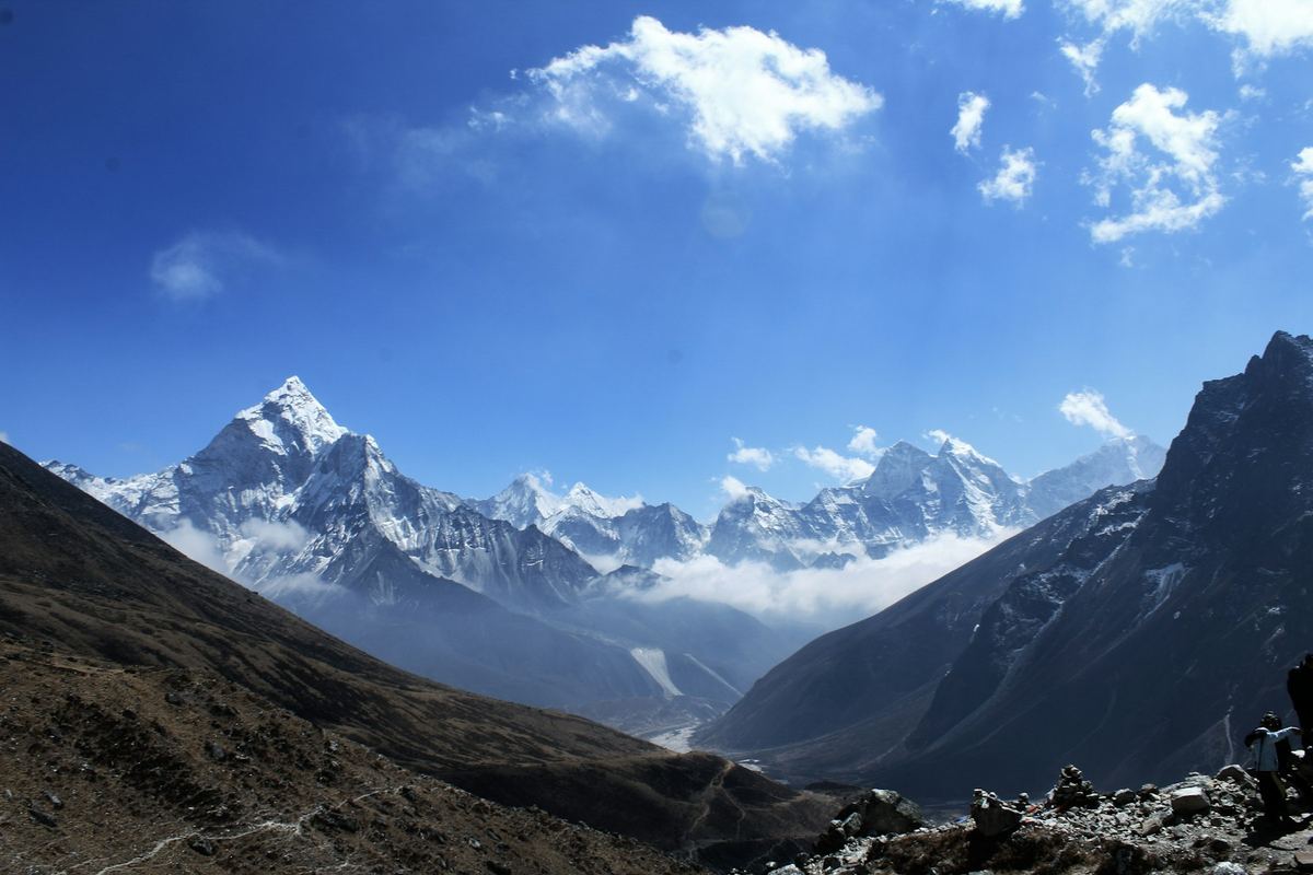 Snow-covered Himalayan peaks under a blue sky